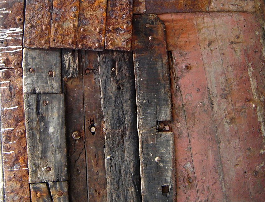 old wood boards that are rusted to look like wooden doors