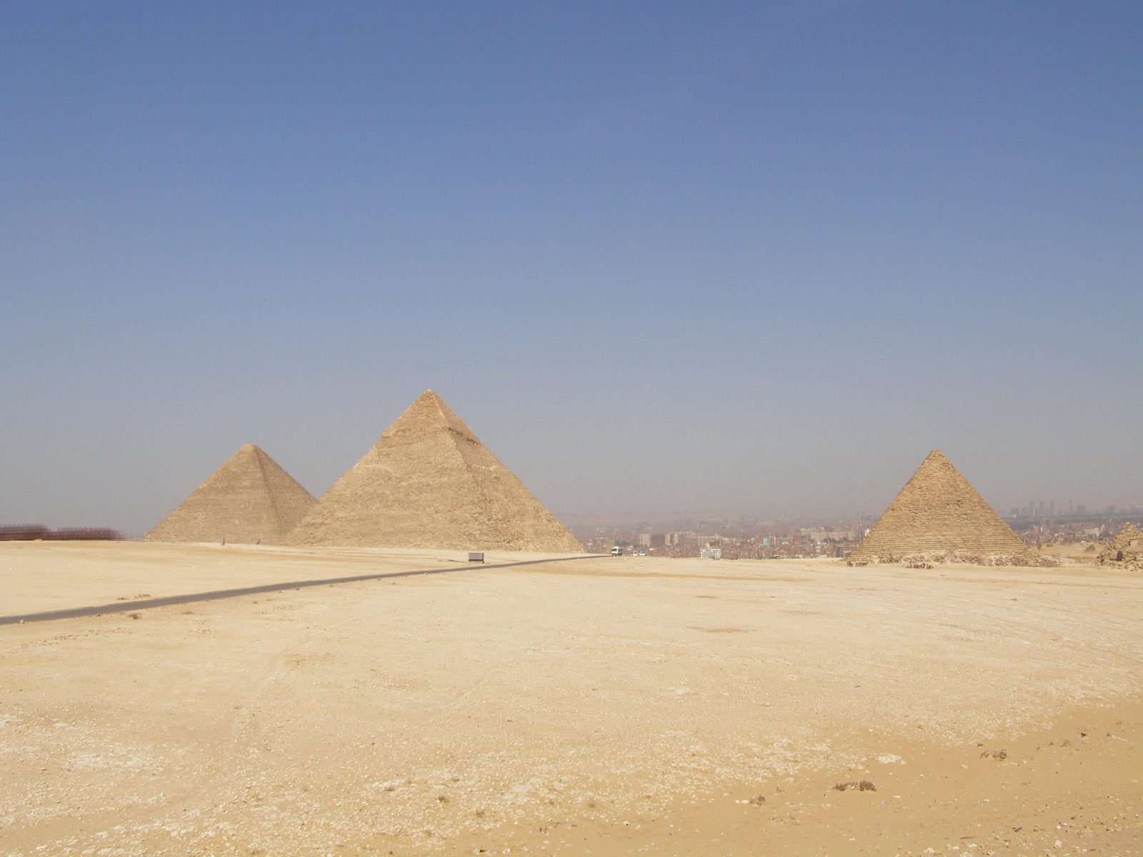 some very tall stone pyramids in the desert