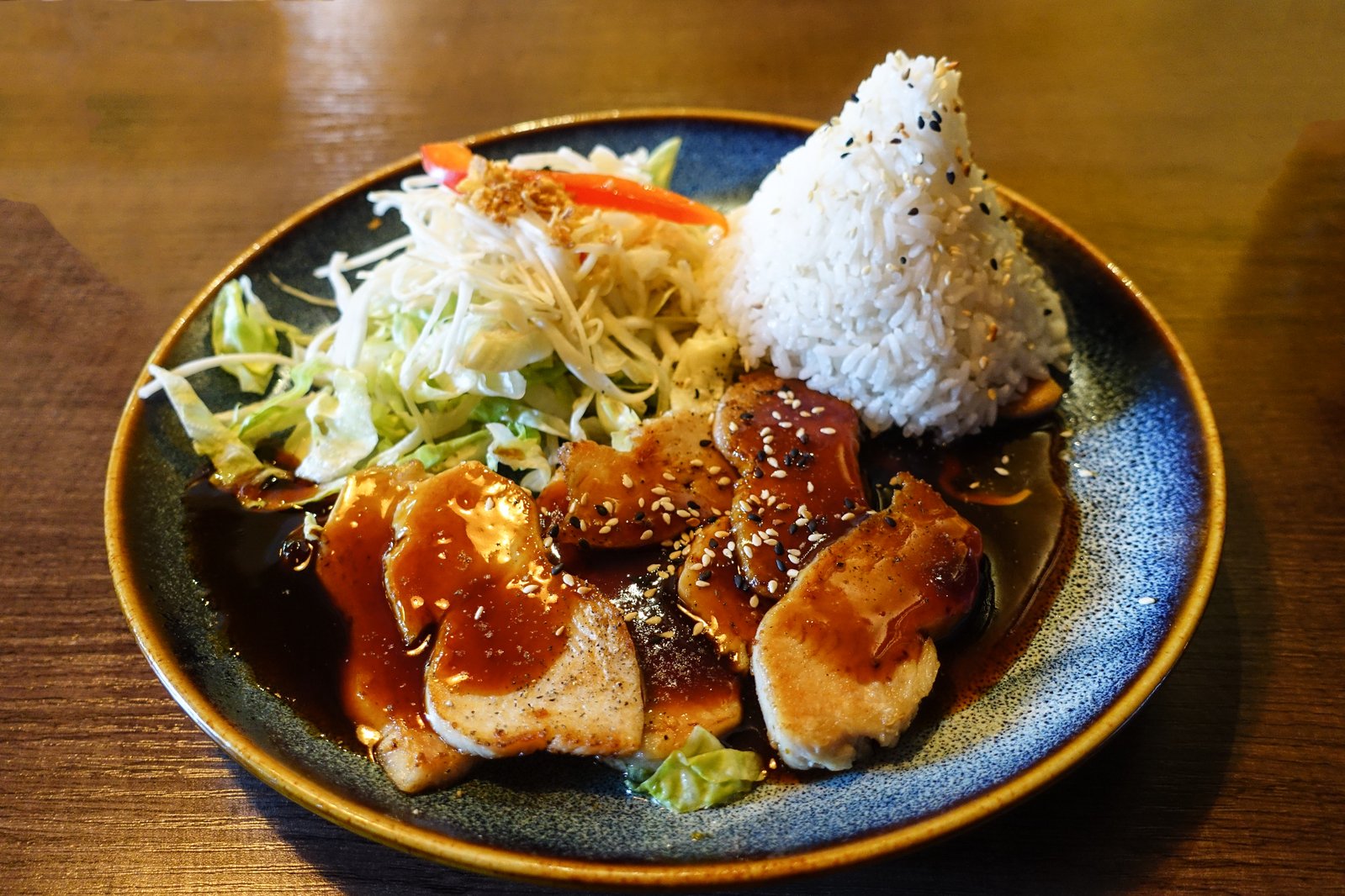 a plate with various foods sitting on top of it