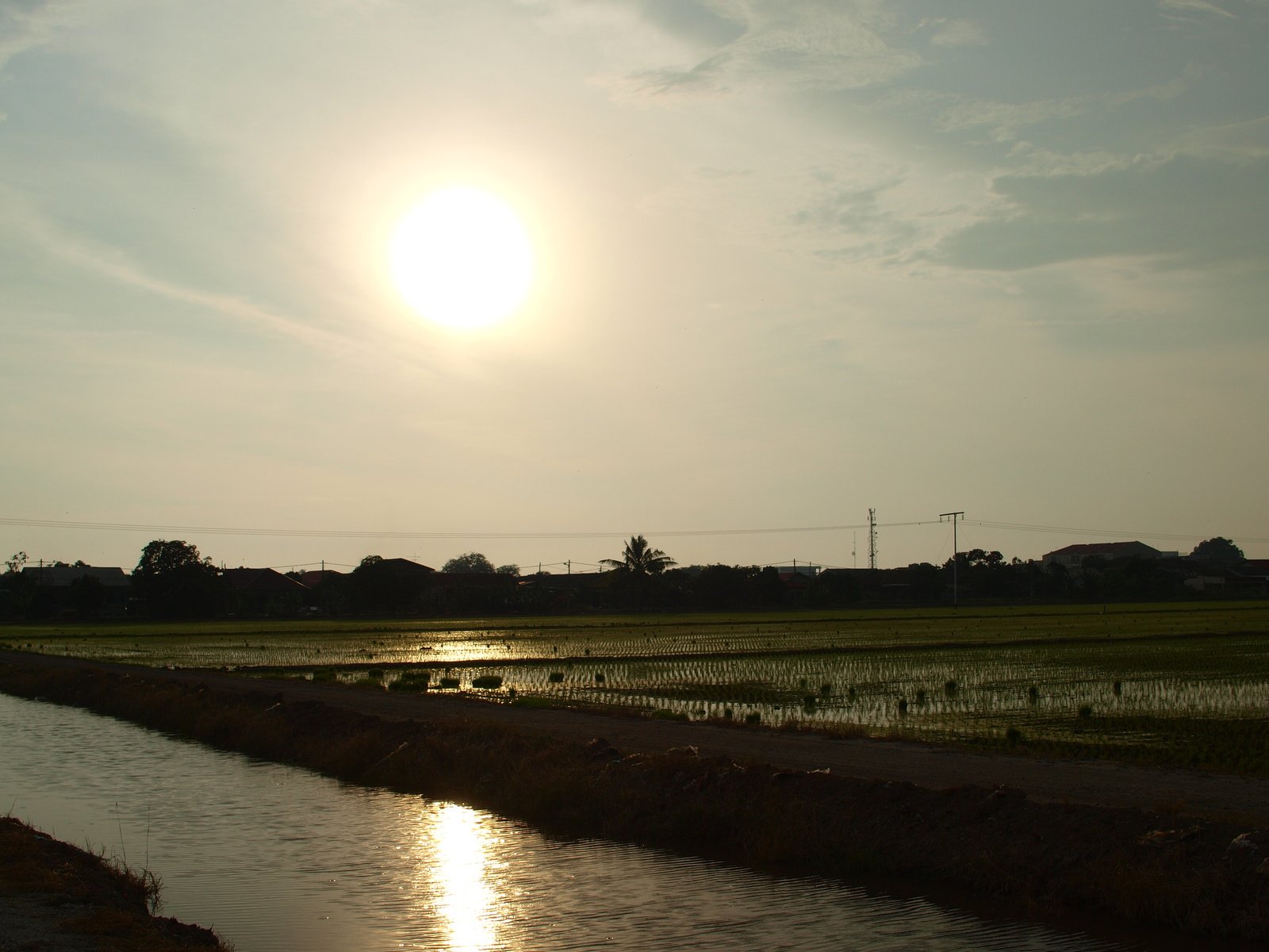 an empty ditch of water under a blue sky