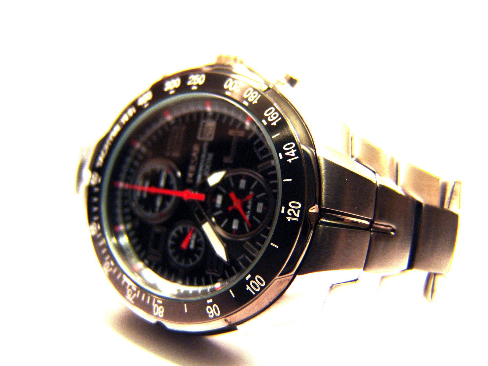 a watch with a red second second second third third ring and bezel