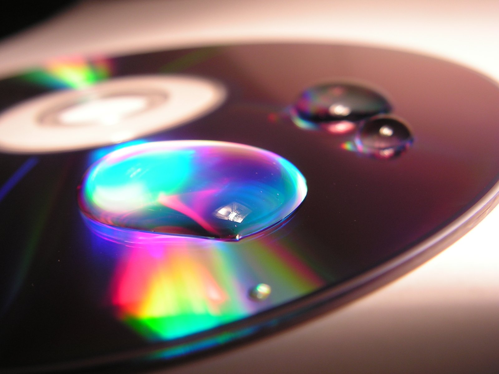 there is a cd with some lights reflected on it