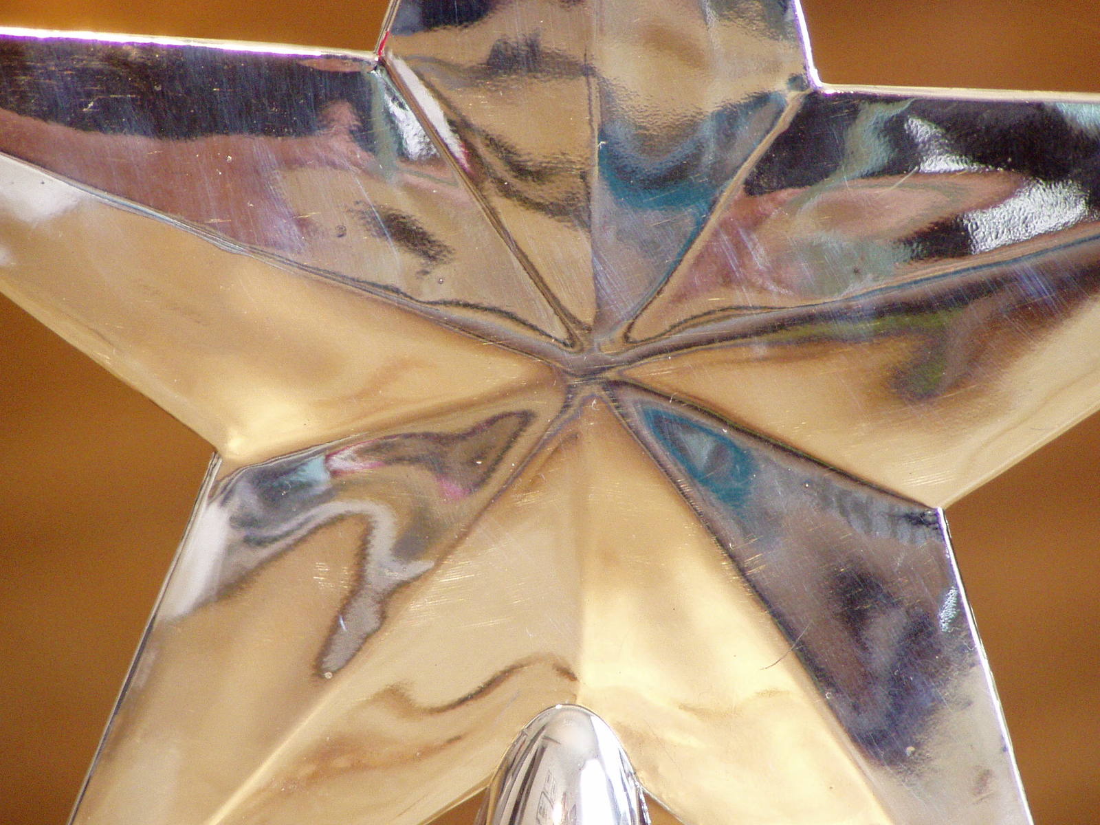 a metal star decoration holding a clock