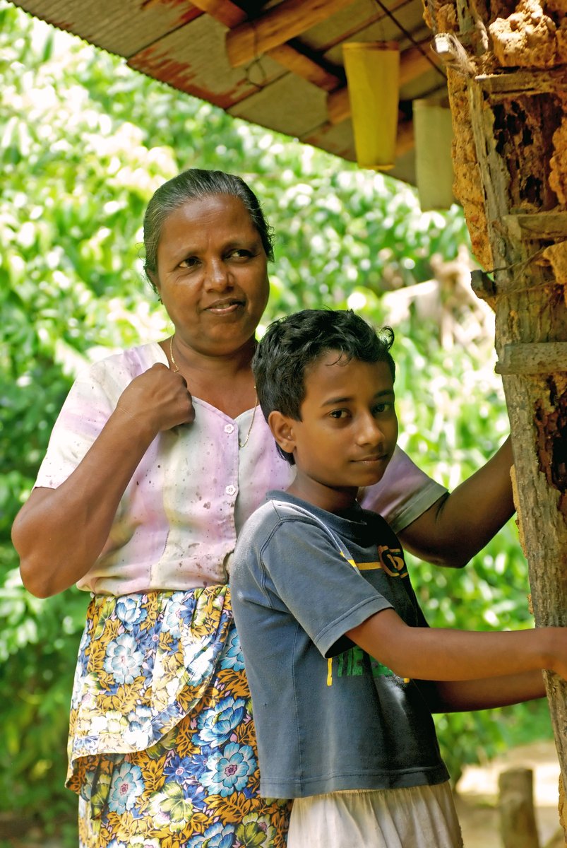 a woman and boy are posing together for a po