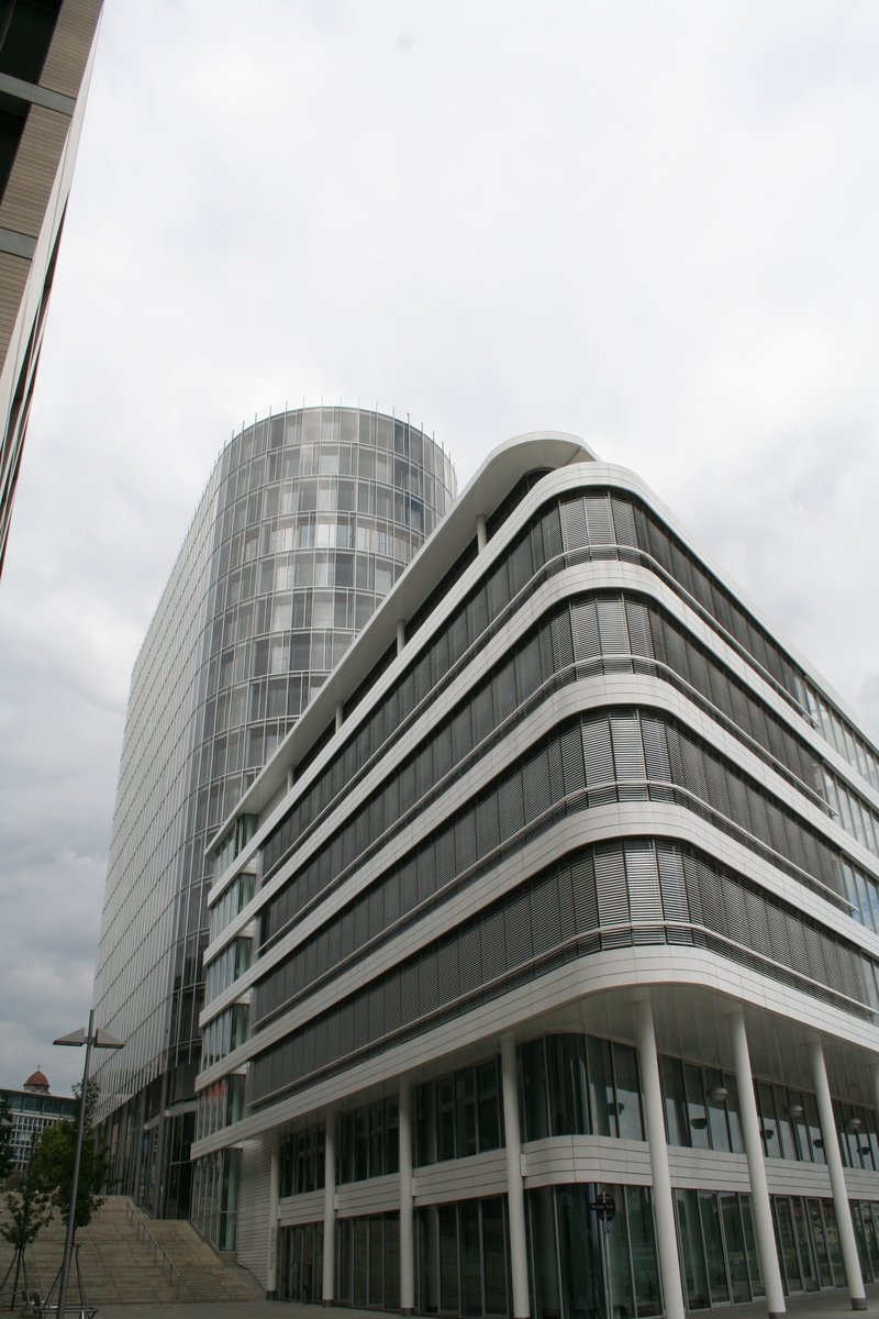 a very tall building in a cloudy sky