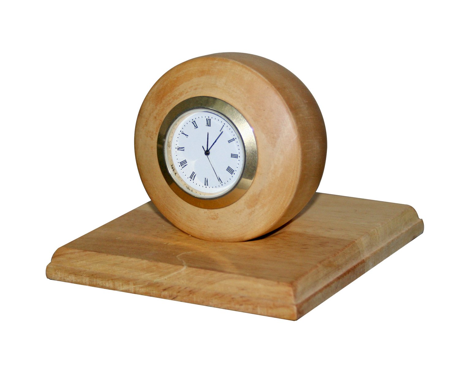 a clock sitting on top of a wooden block