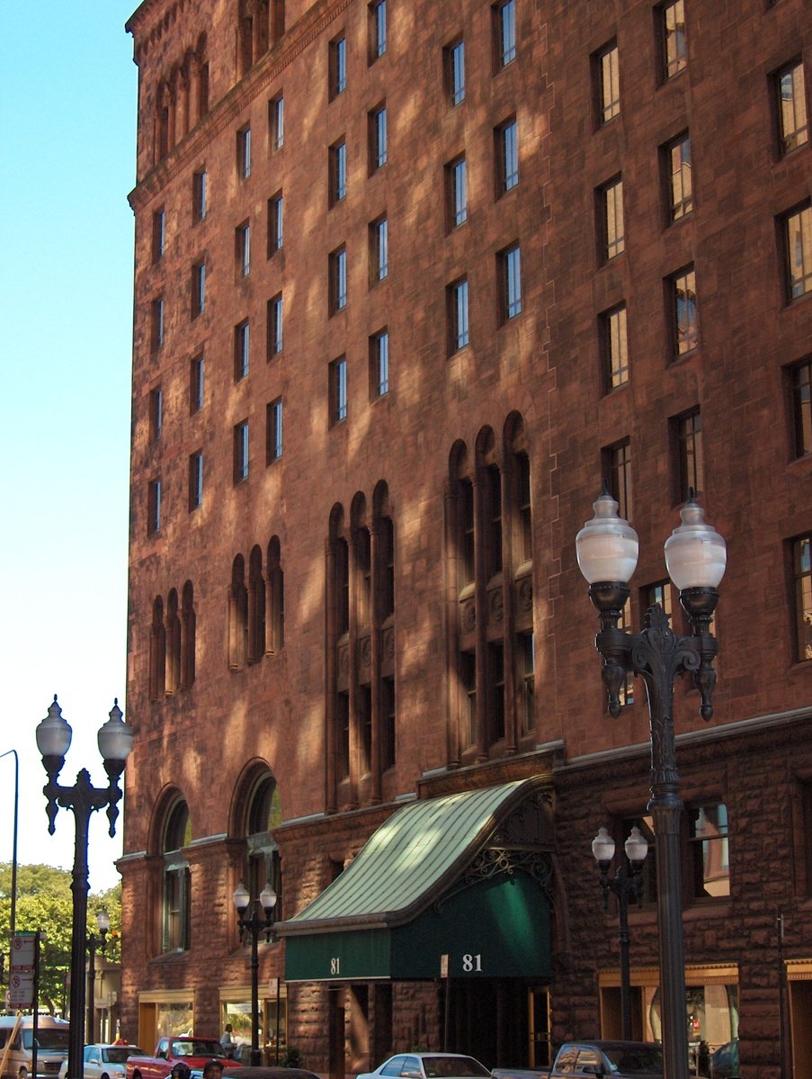 a brick building is shown with tall windows