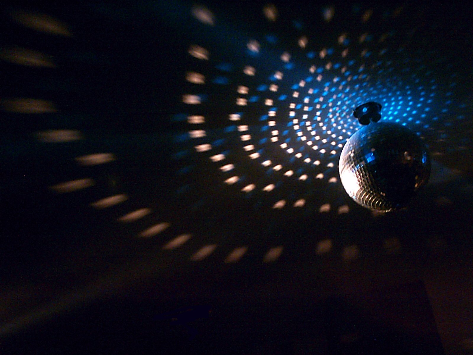 the reflection of a disco ball on the wall