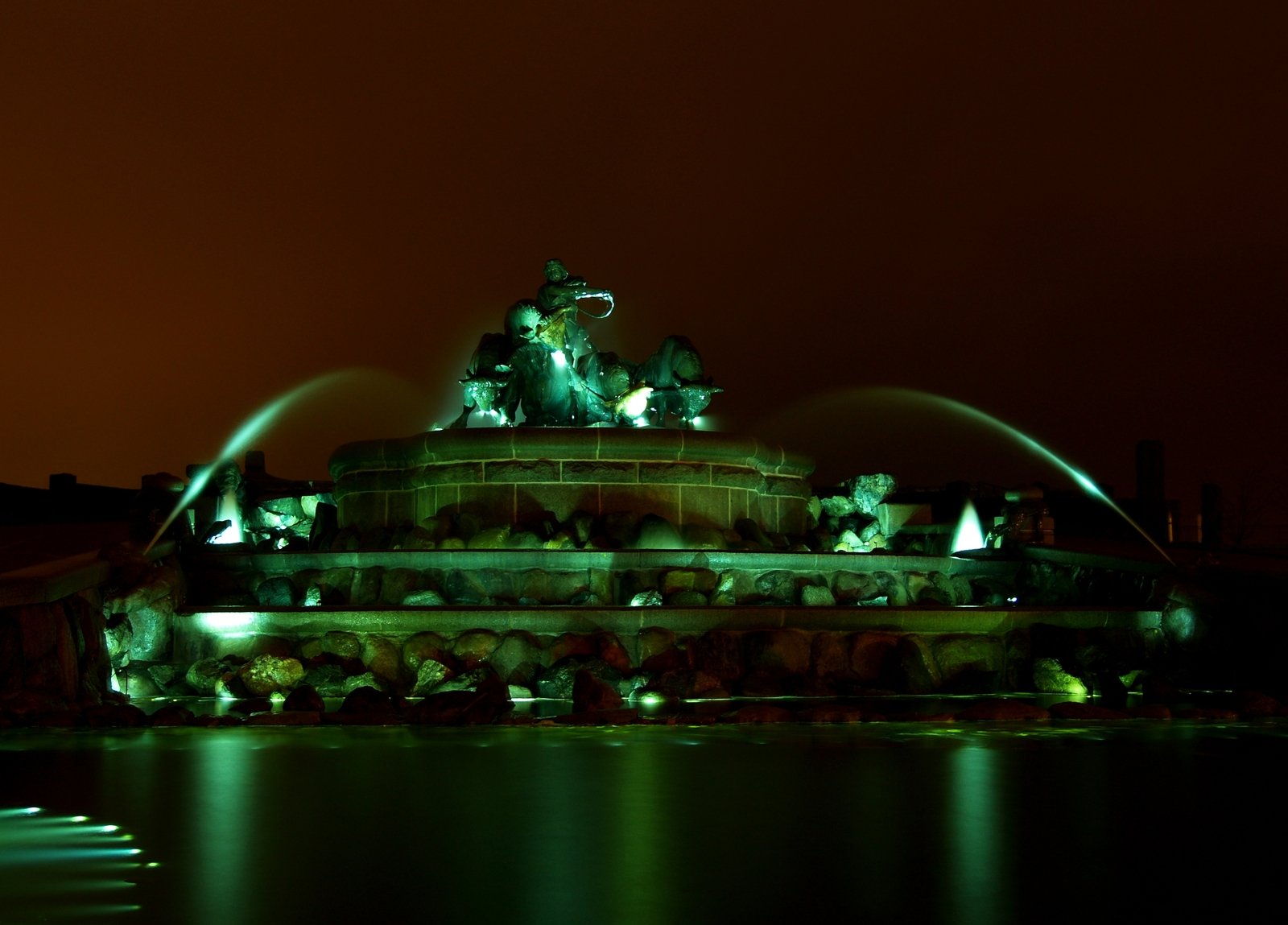 the lights of water show on the building below