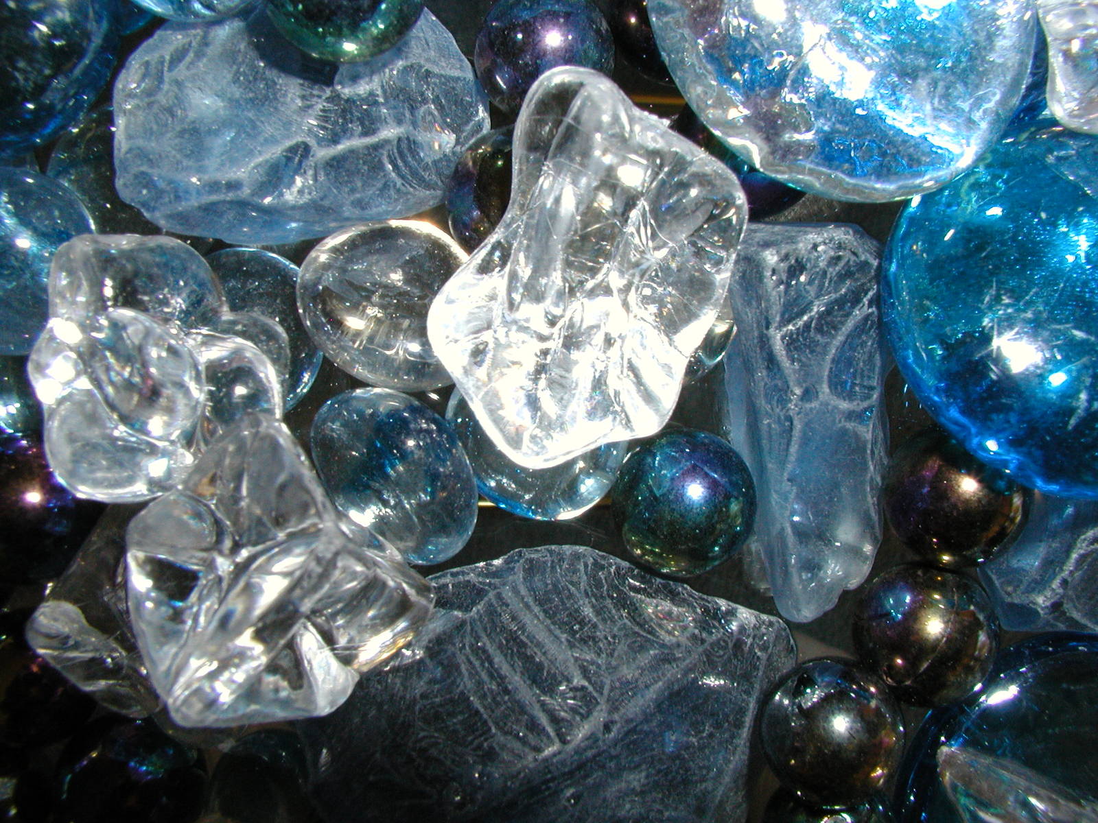 a bunch of glass marbles on display at a table