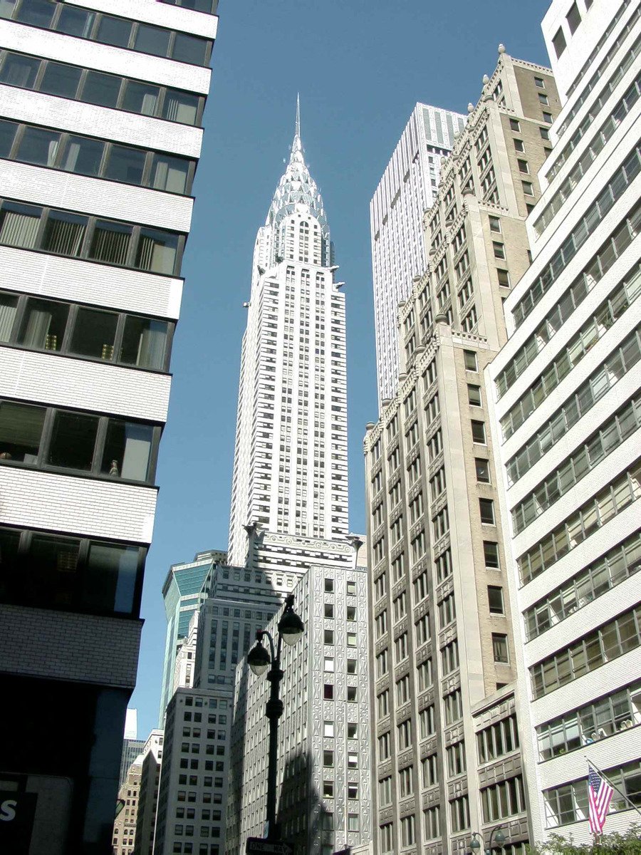 the empire building in new york city is surrounded by other tall buildings