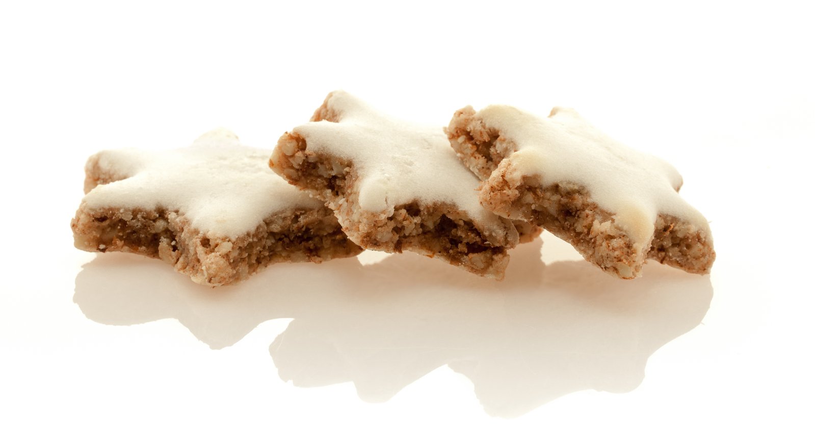 three pieces of dessert sitting together on top of a table