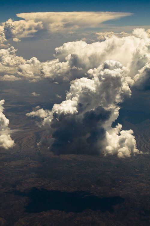 a cloud is over the ground, and in the air