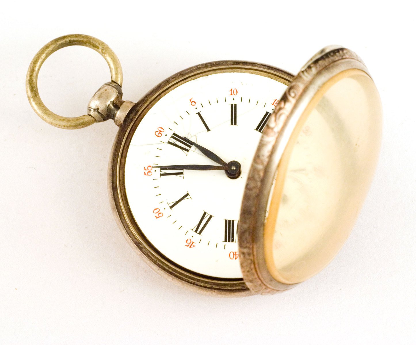 an antique pocket watch with a key chain attached