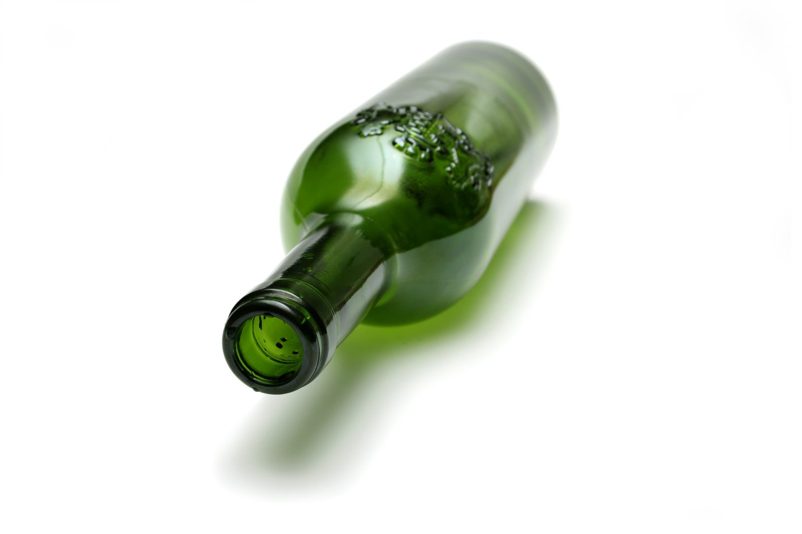 a glass bottle that has been filled with green wine