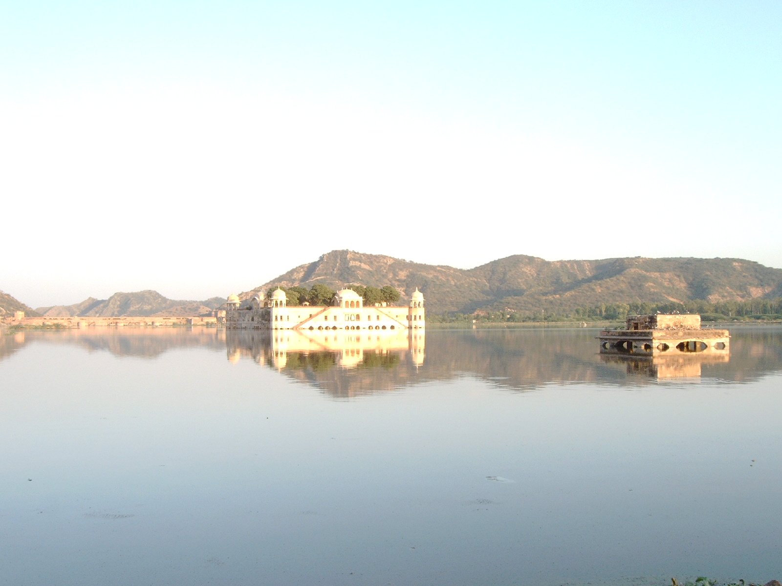 a house is on a small island in the water