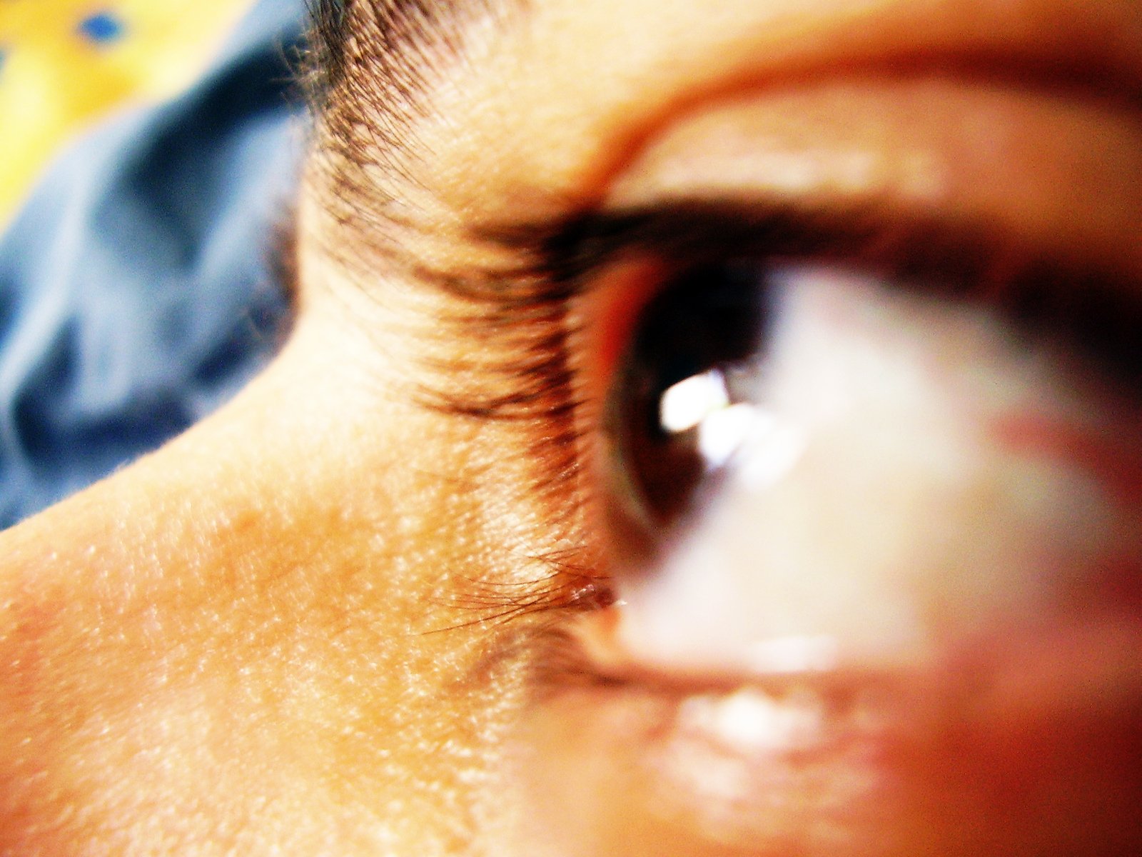 a close - up view of the eye of someone looking into the distance