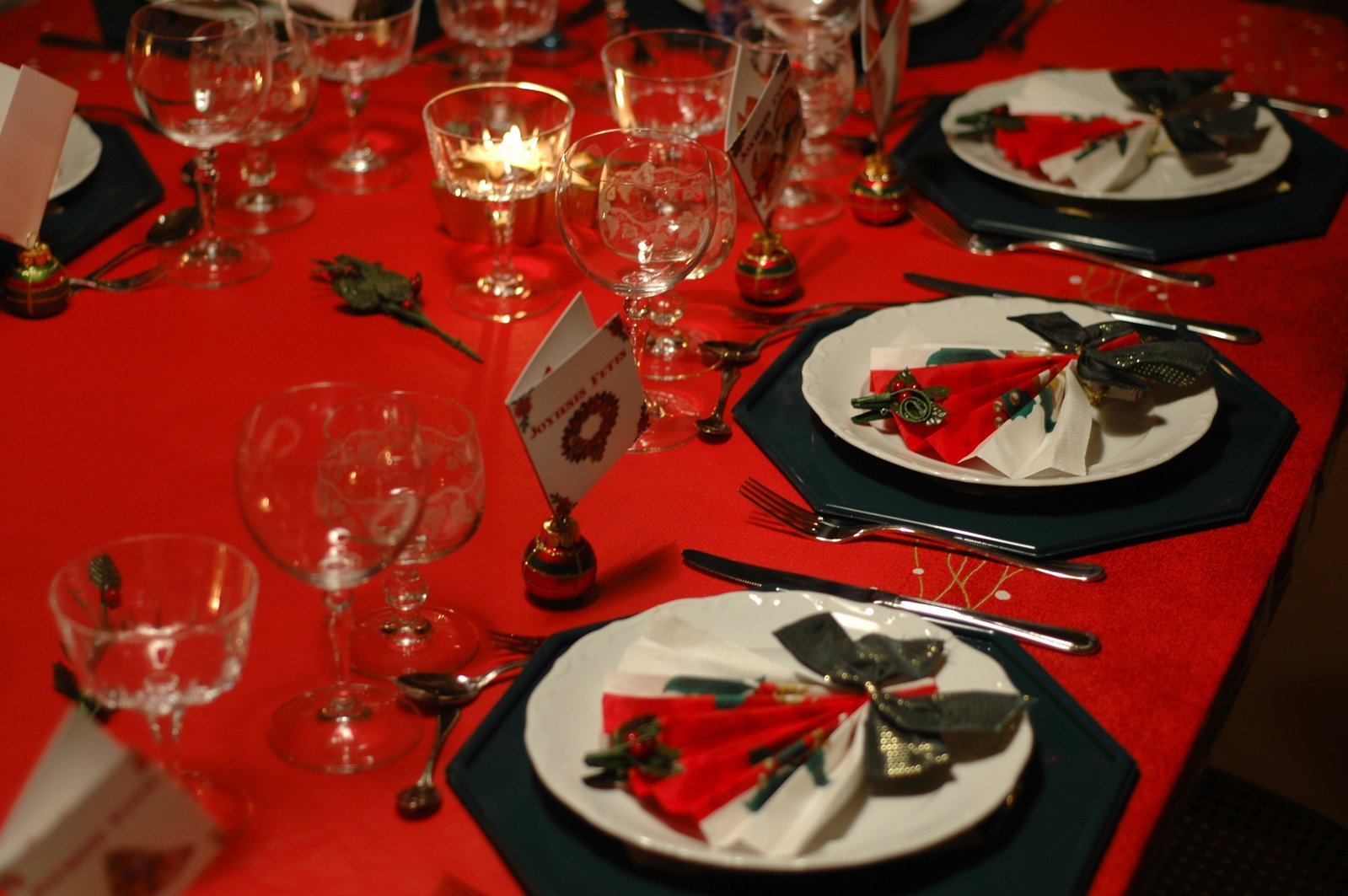 a table with place settings for a holiday dinner