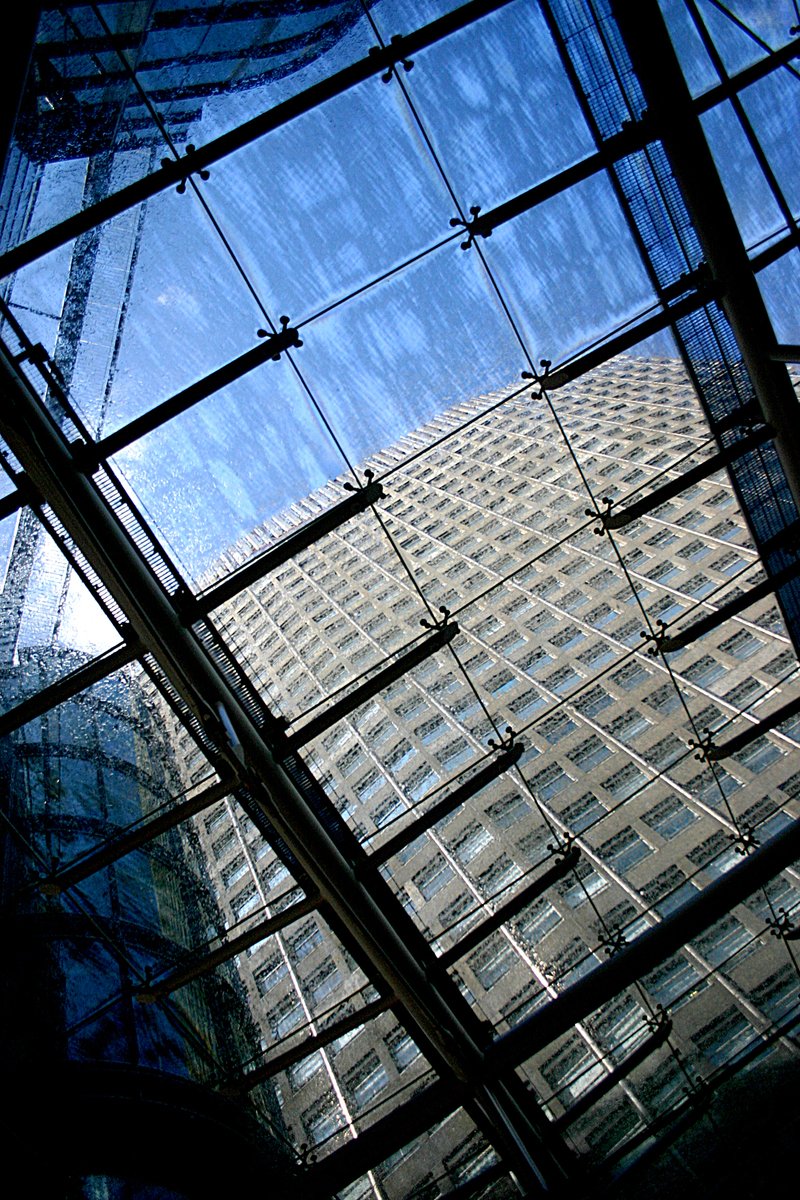 a close - up view of the top of the building through a glass ceiling