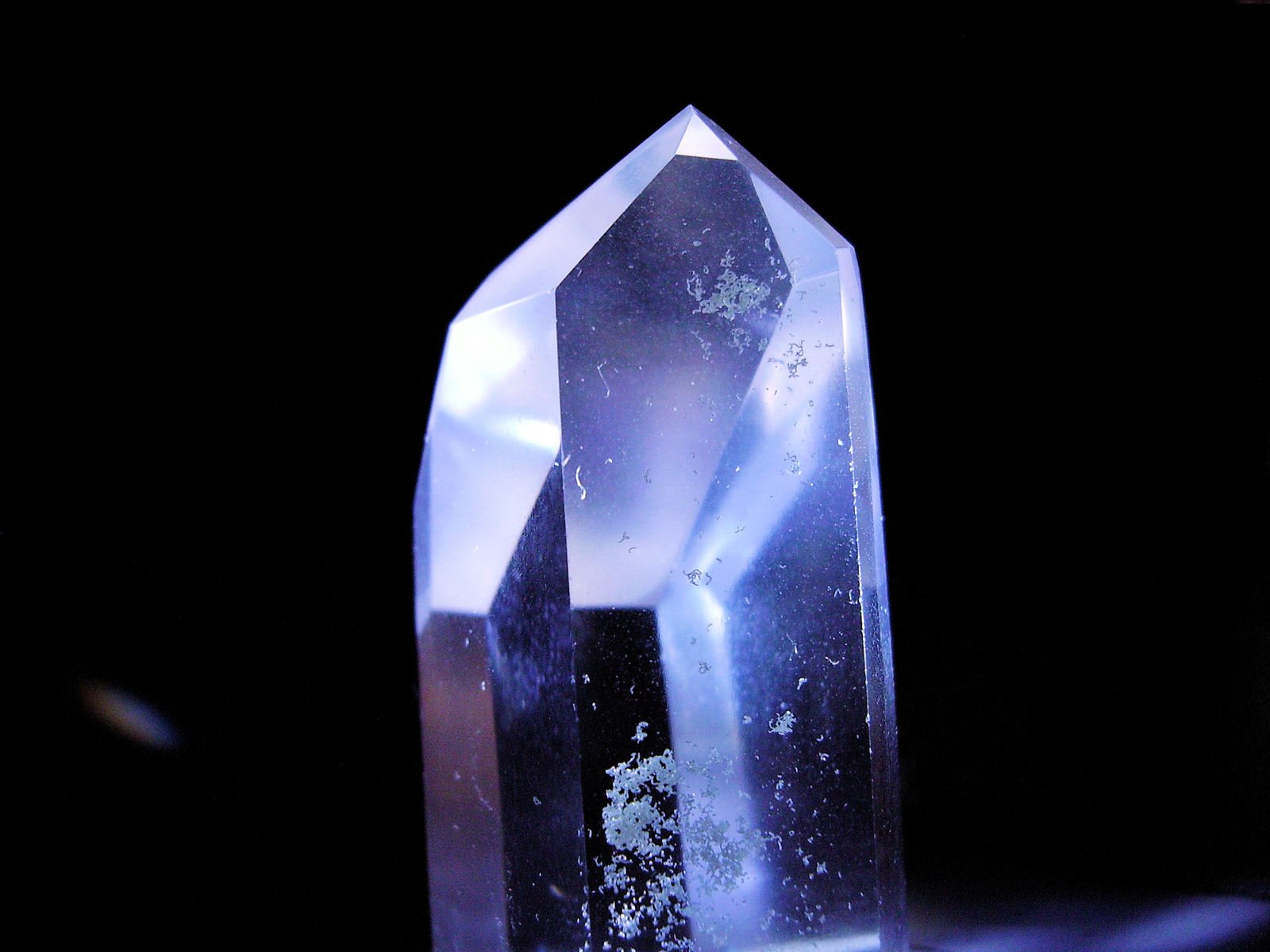 a crystal object sitting on top of a table