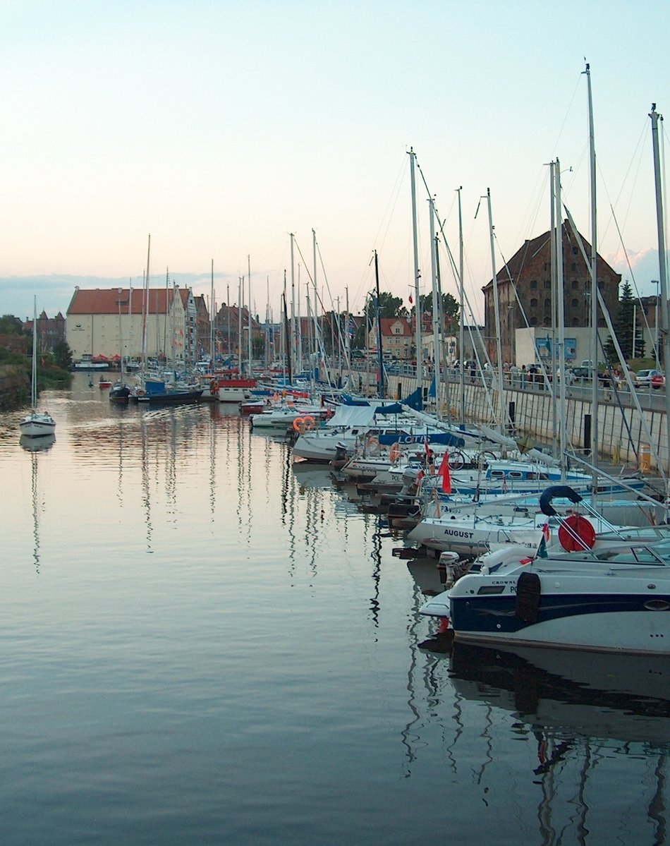a large number of boats are sitting in the water