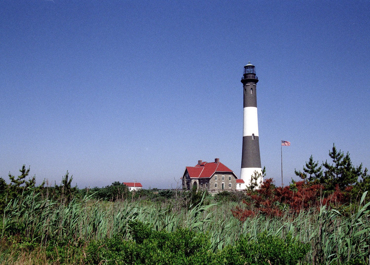 the old lighthouse is located next to the house