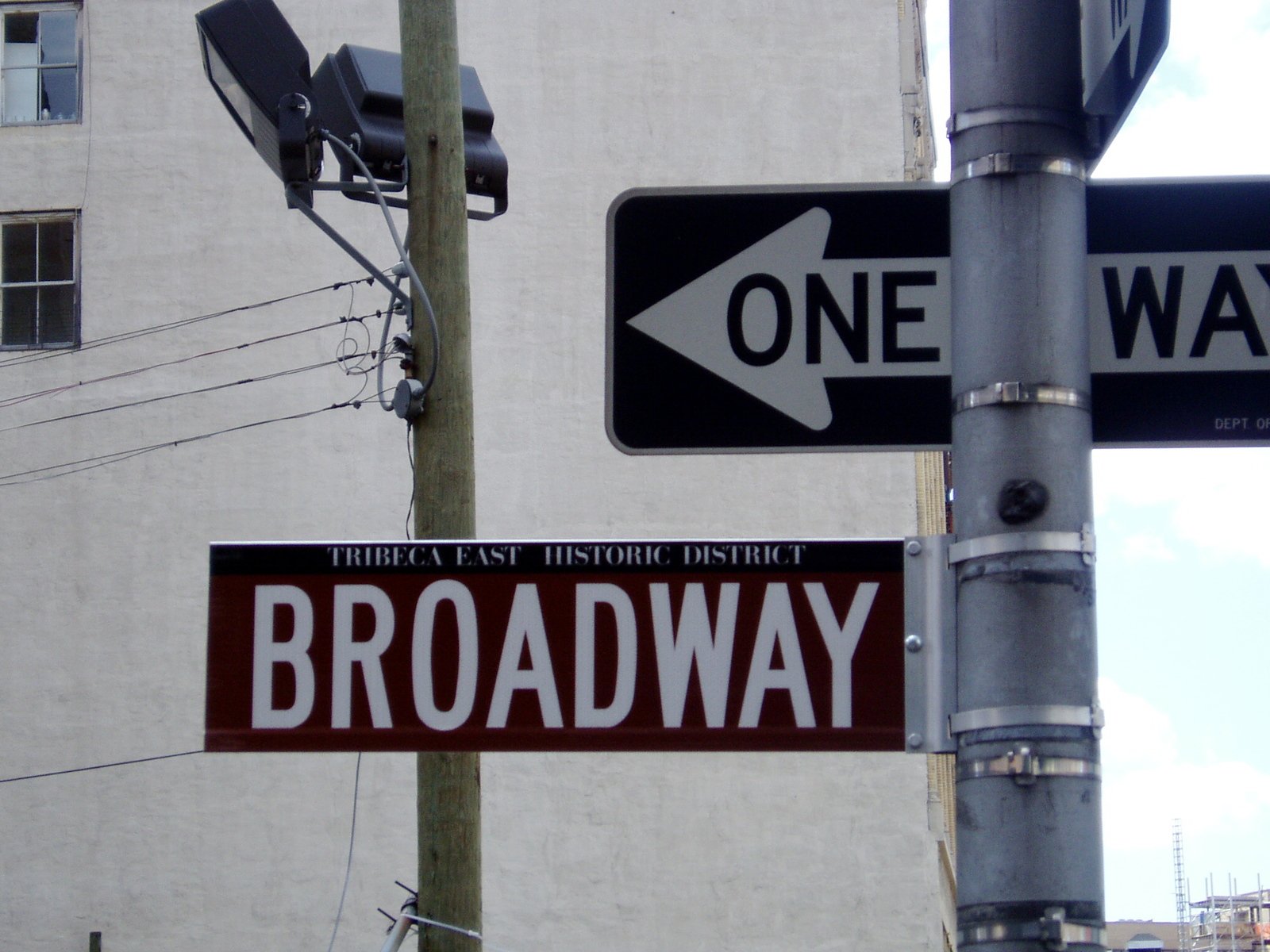 two street signs with one on the left and the other on the right