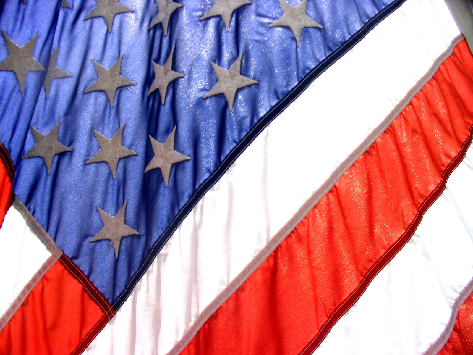 an american flag with silver stars and red, white, and blue stripes