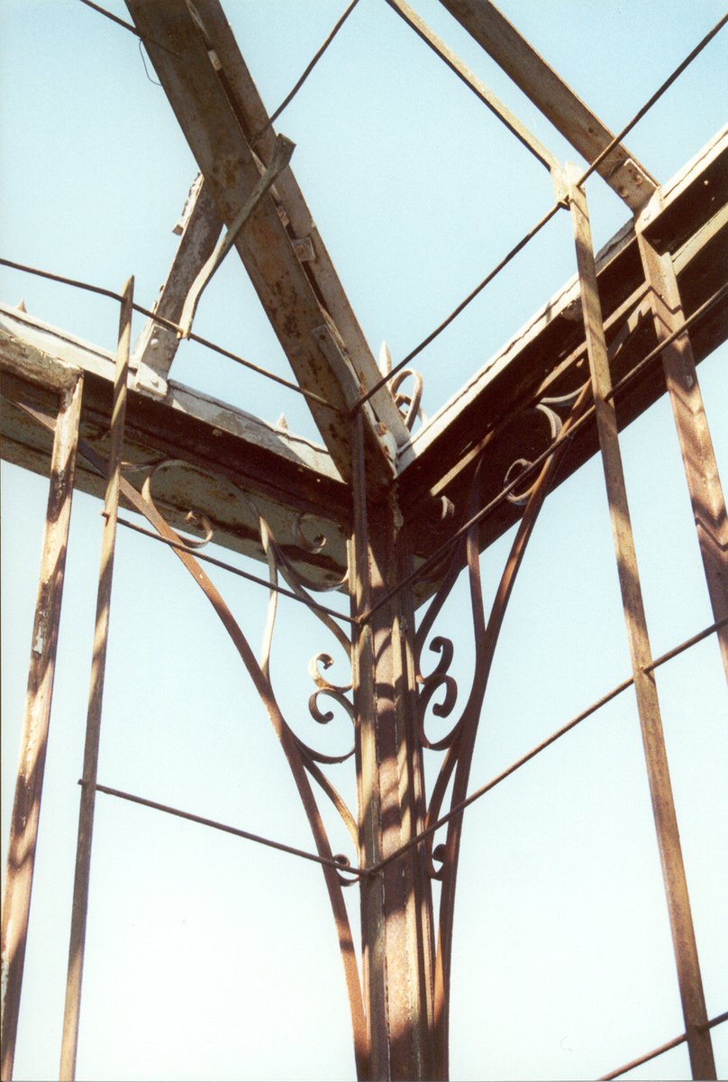 a wooden structure that is surrounded by wires