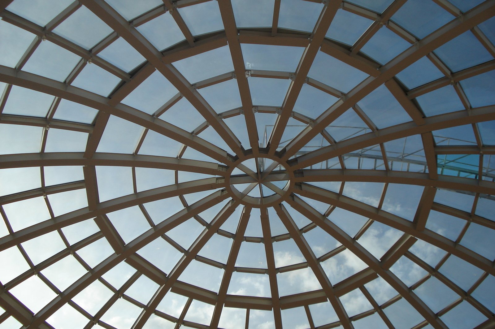 a glass ceiling with a sky background