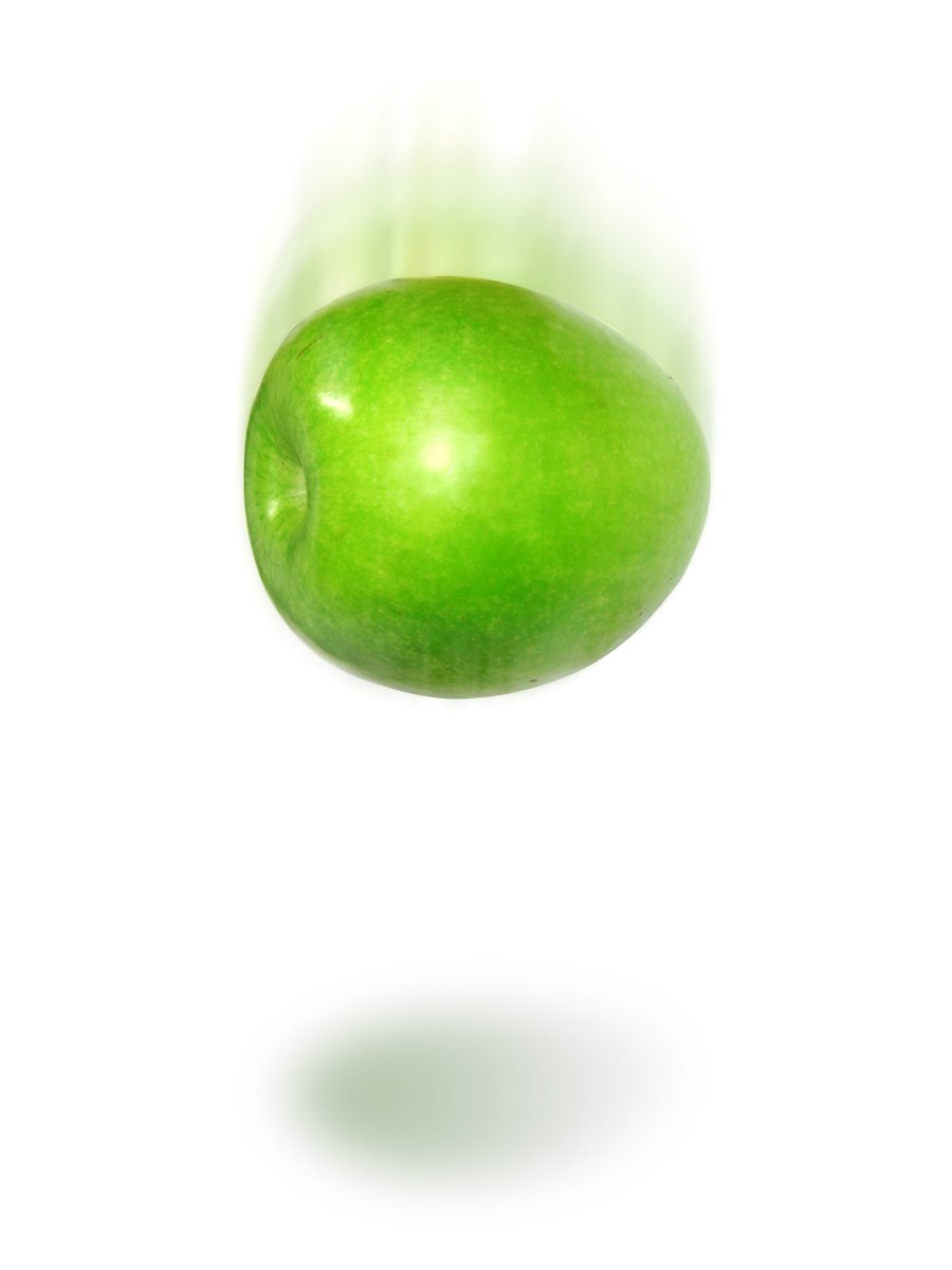 an apple that is green with no leafs in it