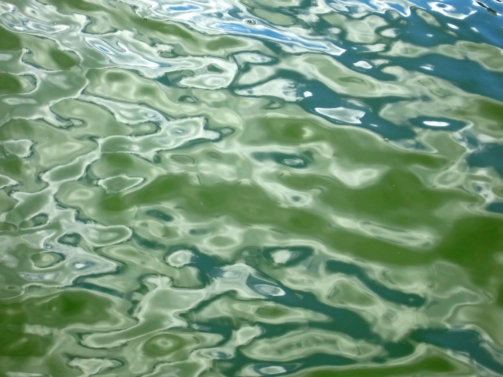 an image of a boat's reflections on the water