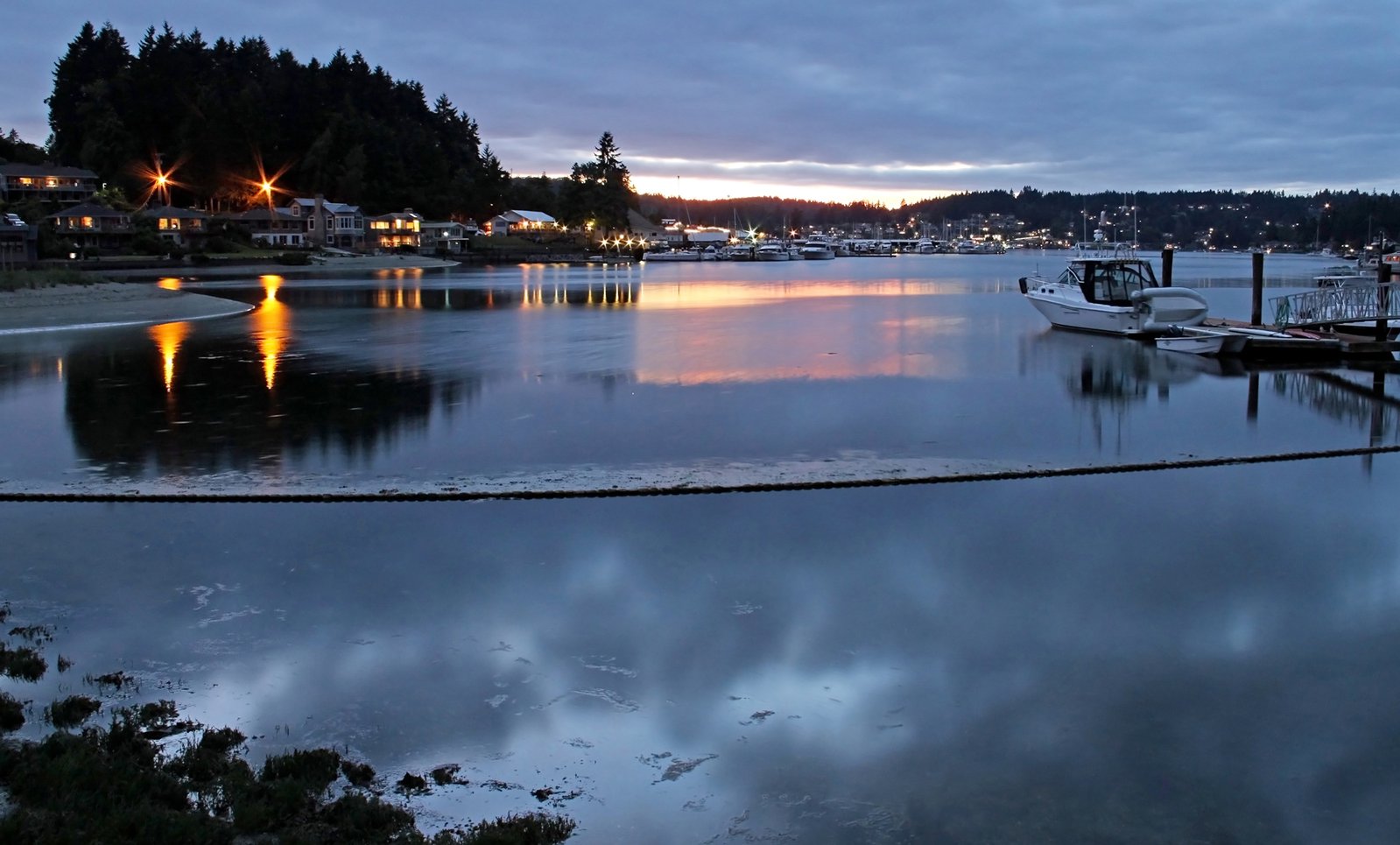 a small harbor has many boats on it