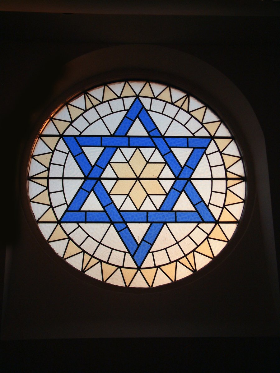the window in the room is decorated with blue stars