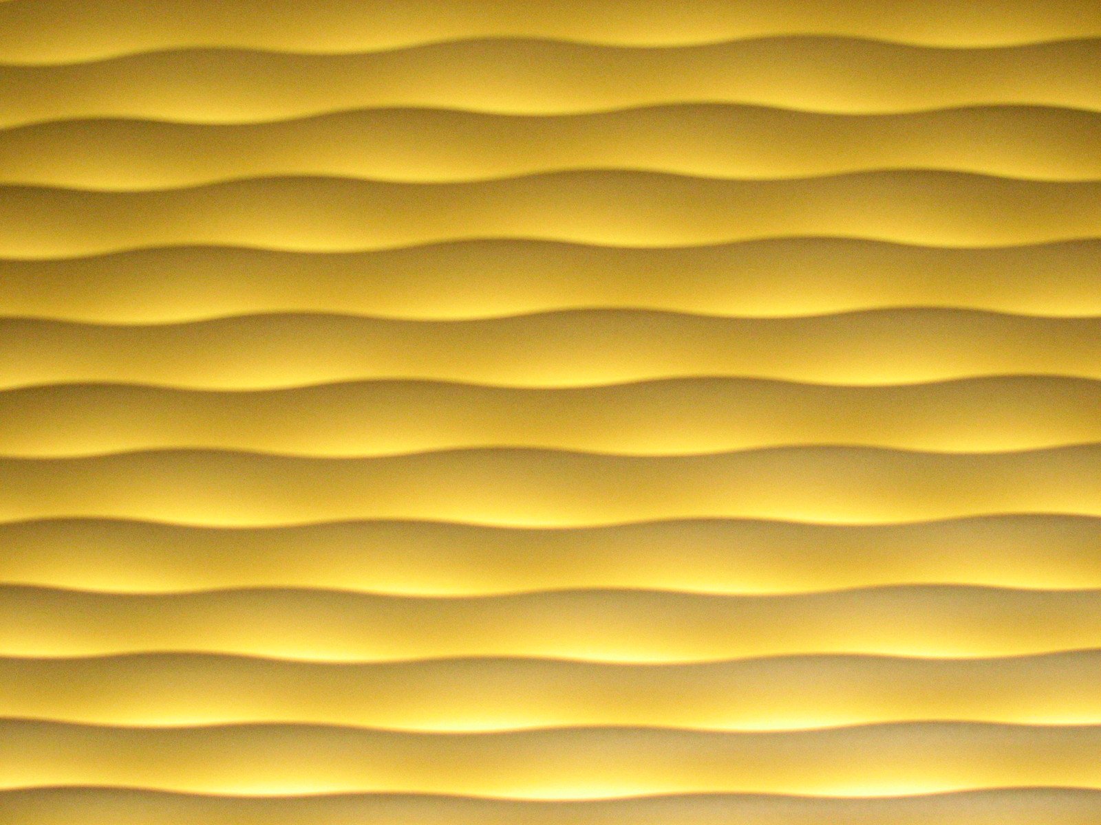 abstract yellow wavy paper that looks like waves