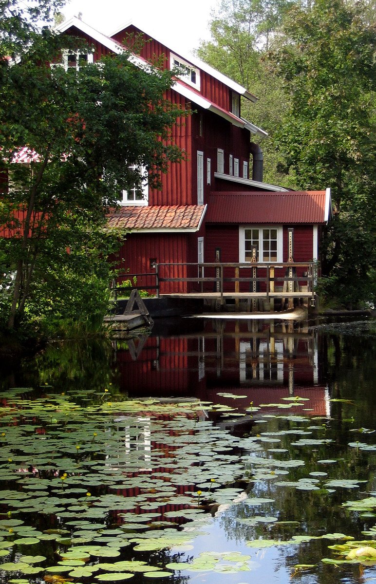 a house sitting on top of a body of water