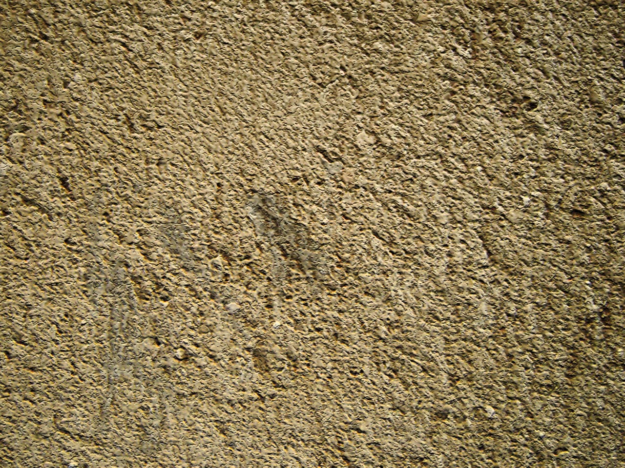 a brown surface of cement is shown with a small animal drawn on the concrete