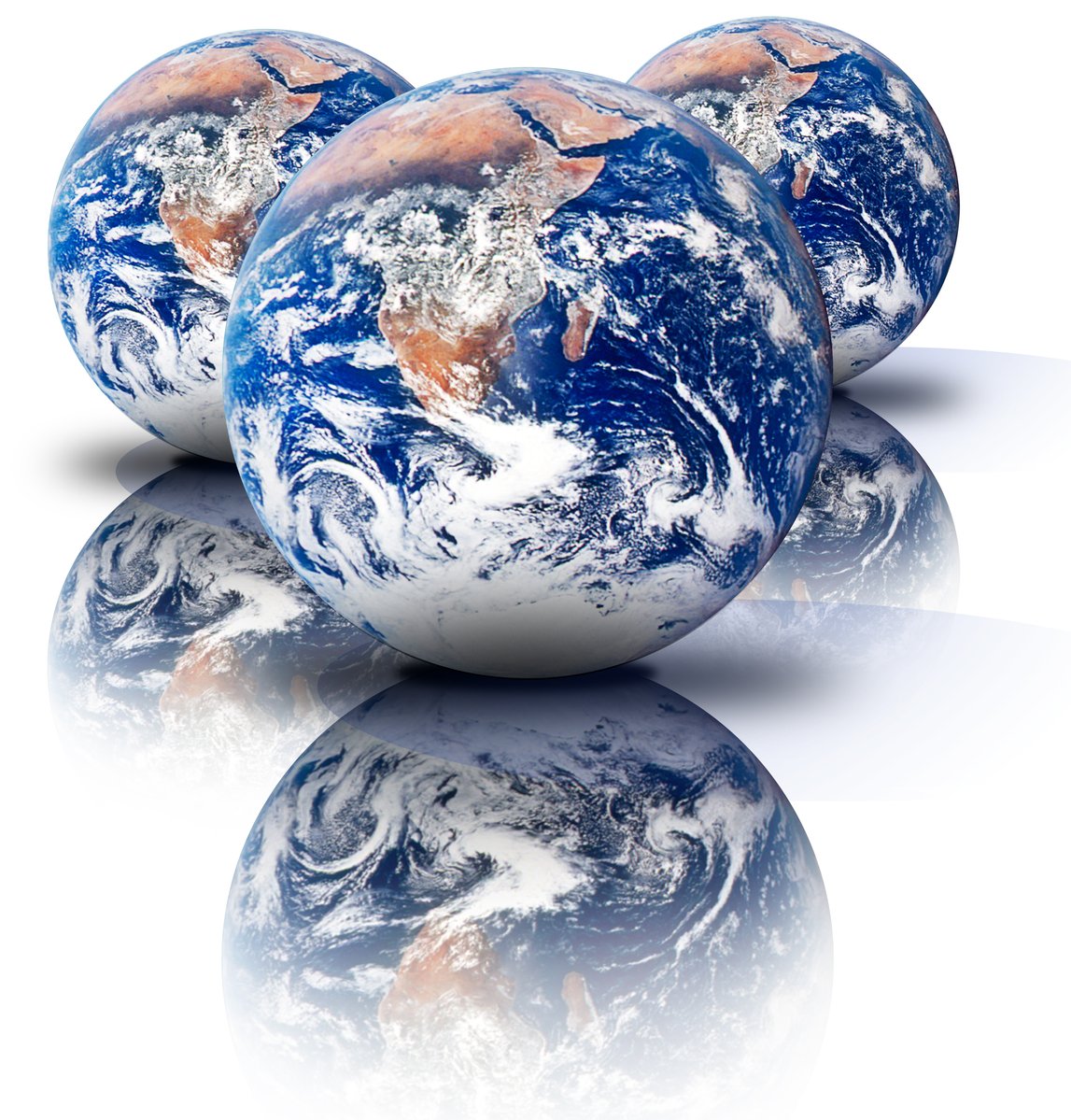 three blue and brown earth globes with reflections on the ground