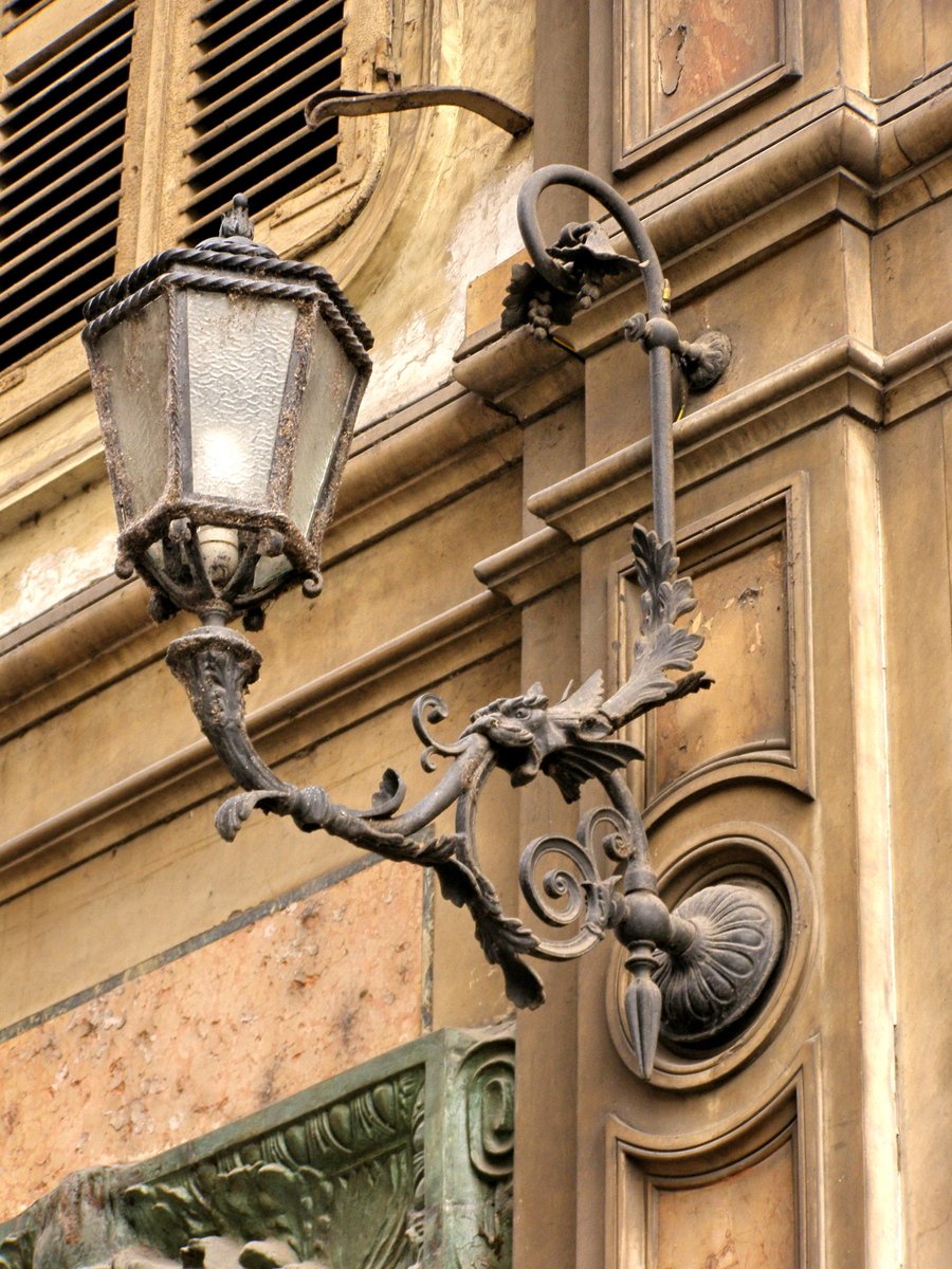 a fancy looking lamp and light on the wall