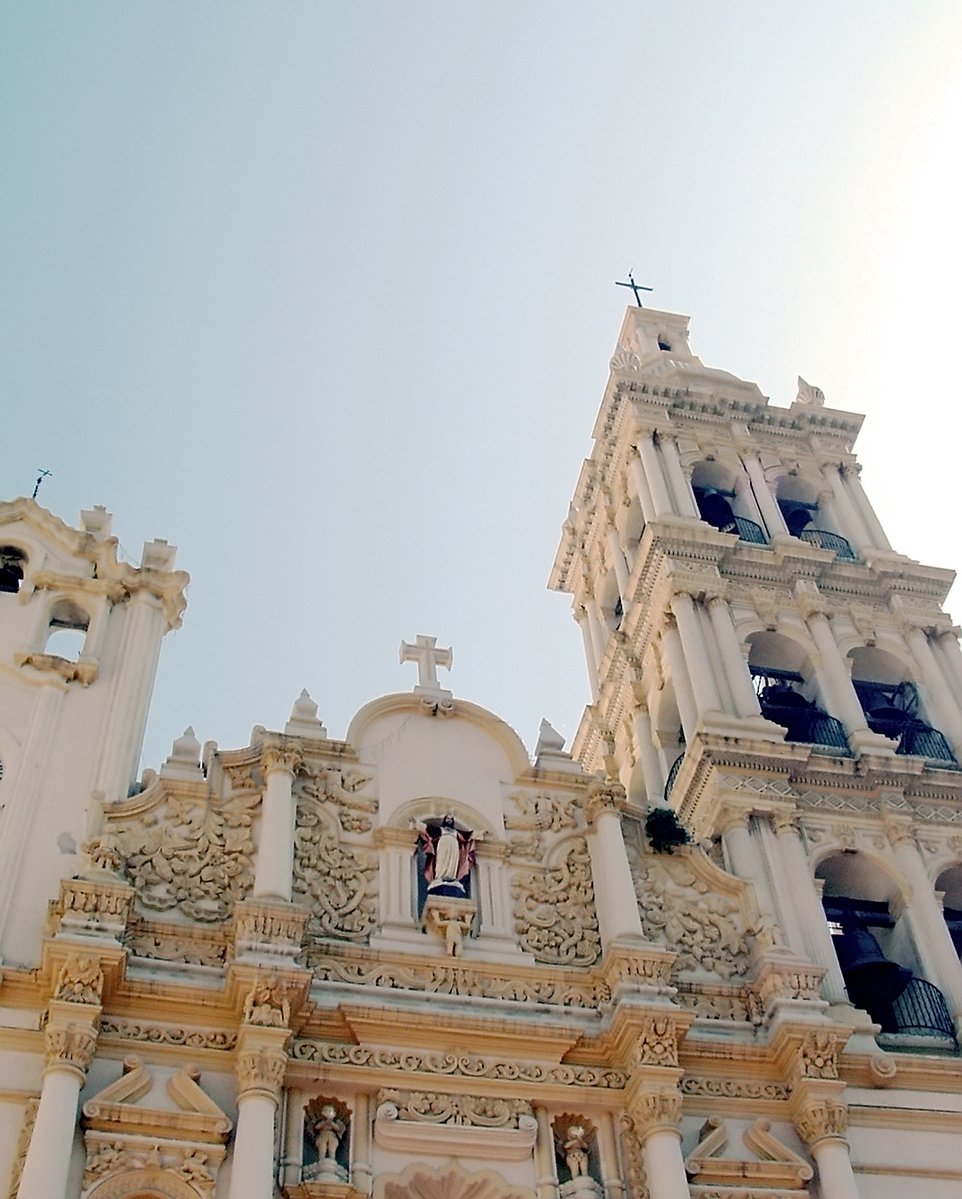 an old church with a tall steeple and steeples