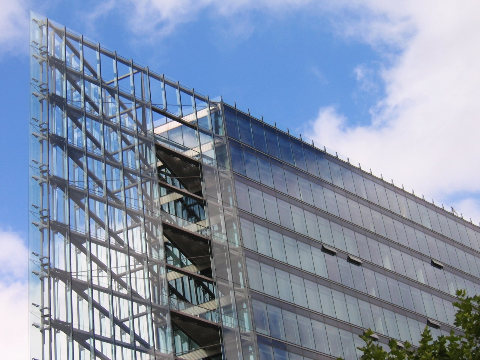 the side of an office building with a glass sculpture