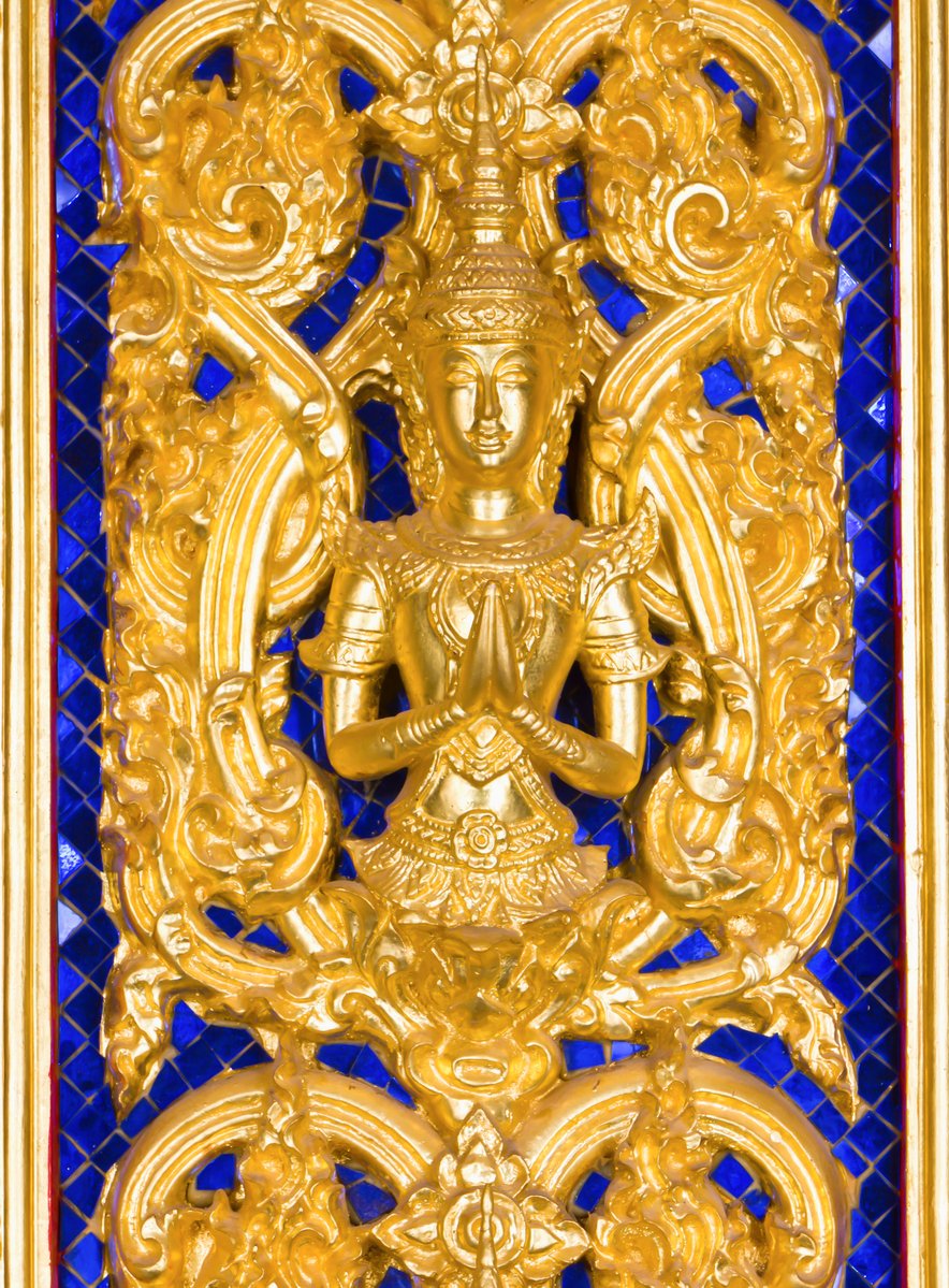 this is a gold - plated indian figure in color