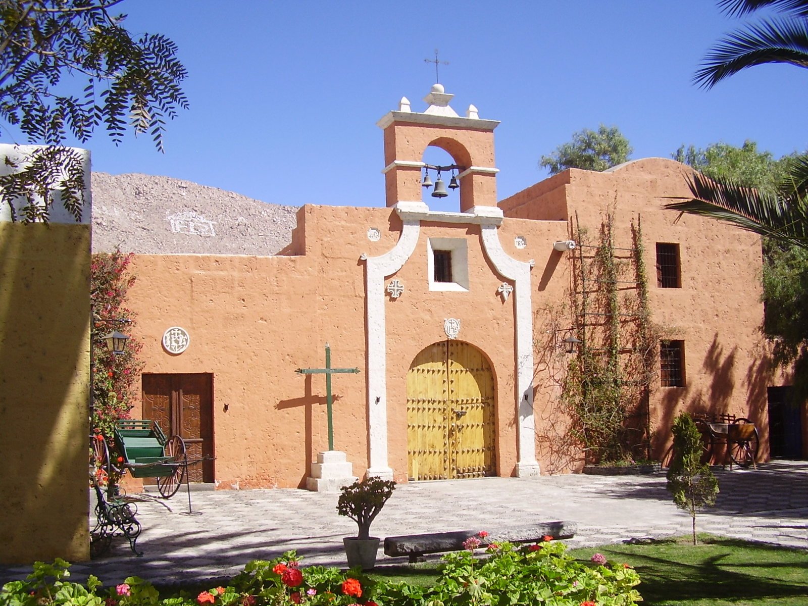 a church with three bells on top of it