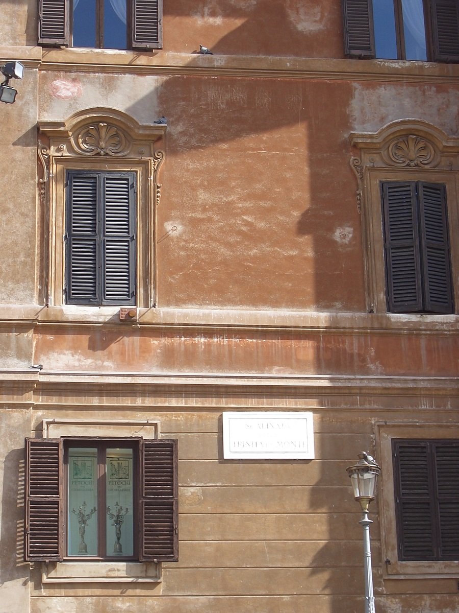 the window frames and shutters of an old building