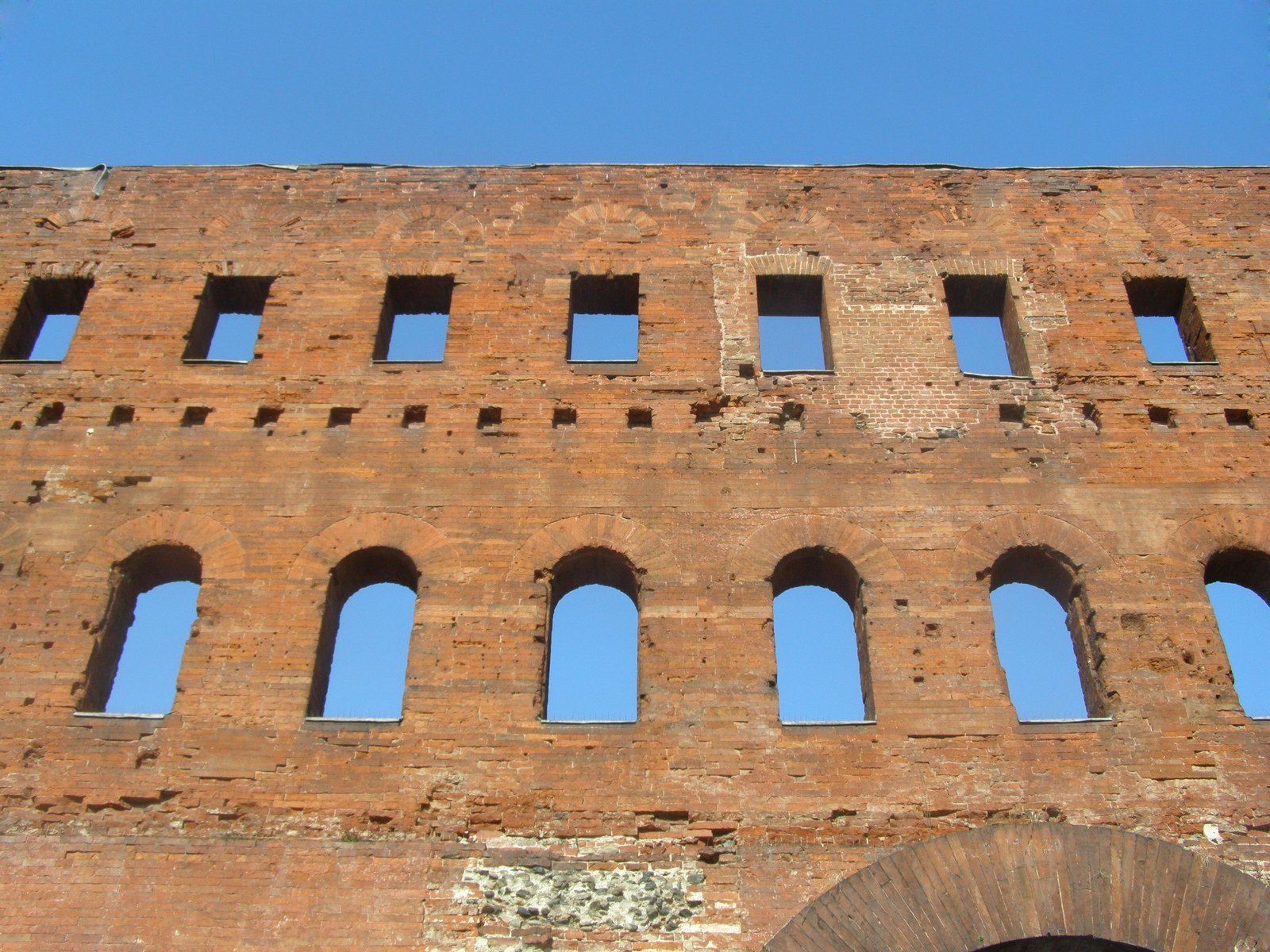 several windows that have a sky background behind them