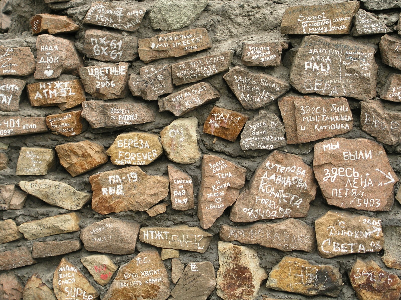 many different rock that has writing on them
