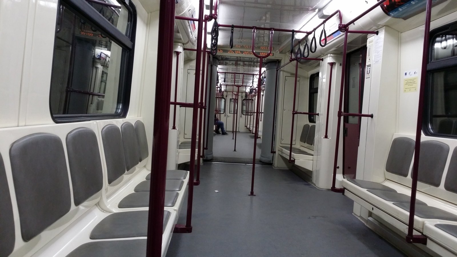 inside the empty subway train car where passengers are seen