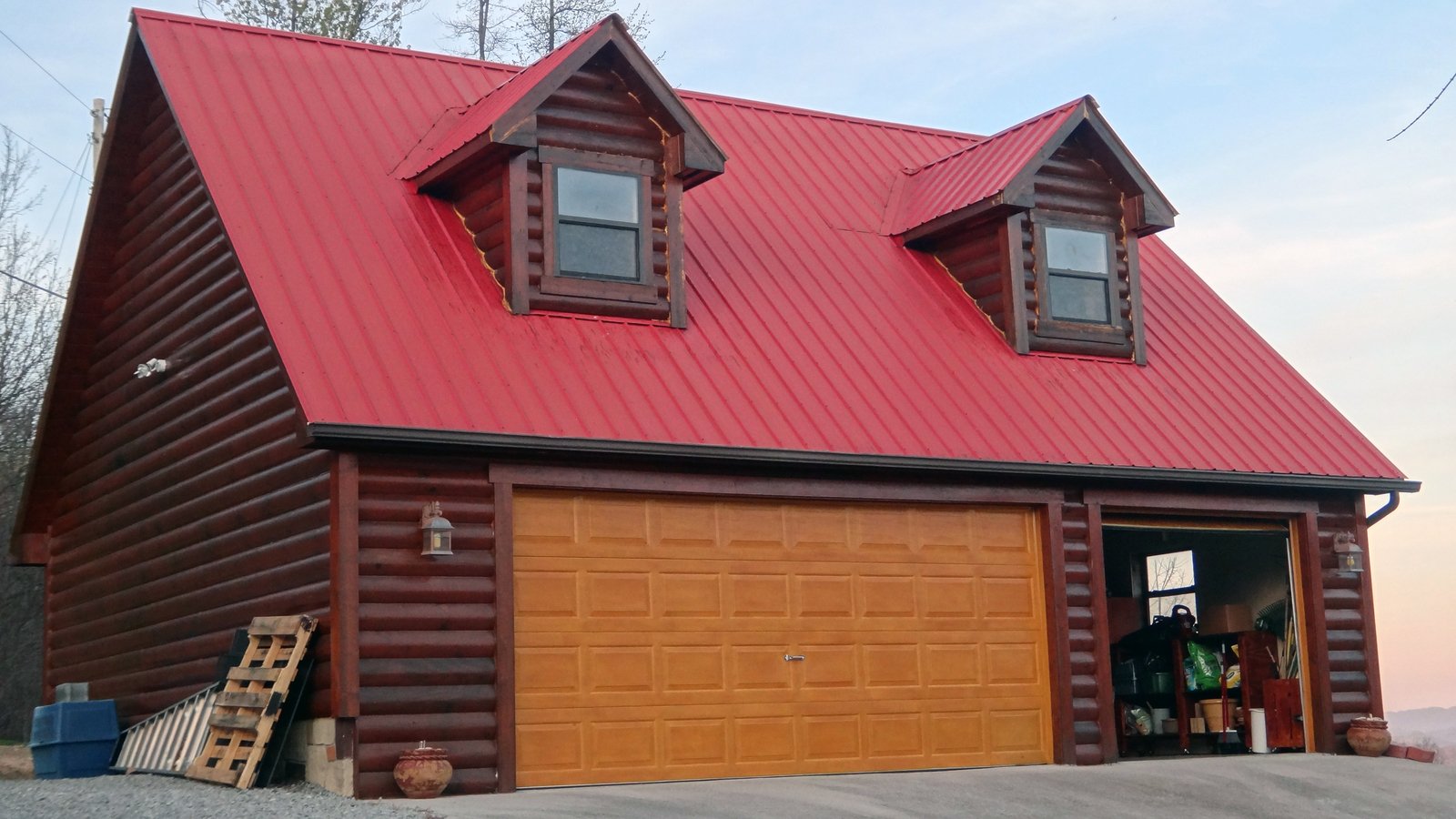 a red roof and two double door garage