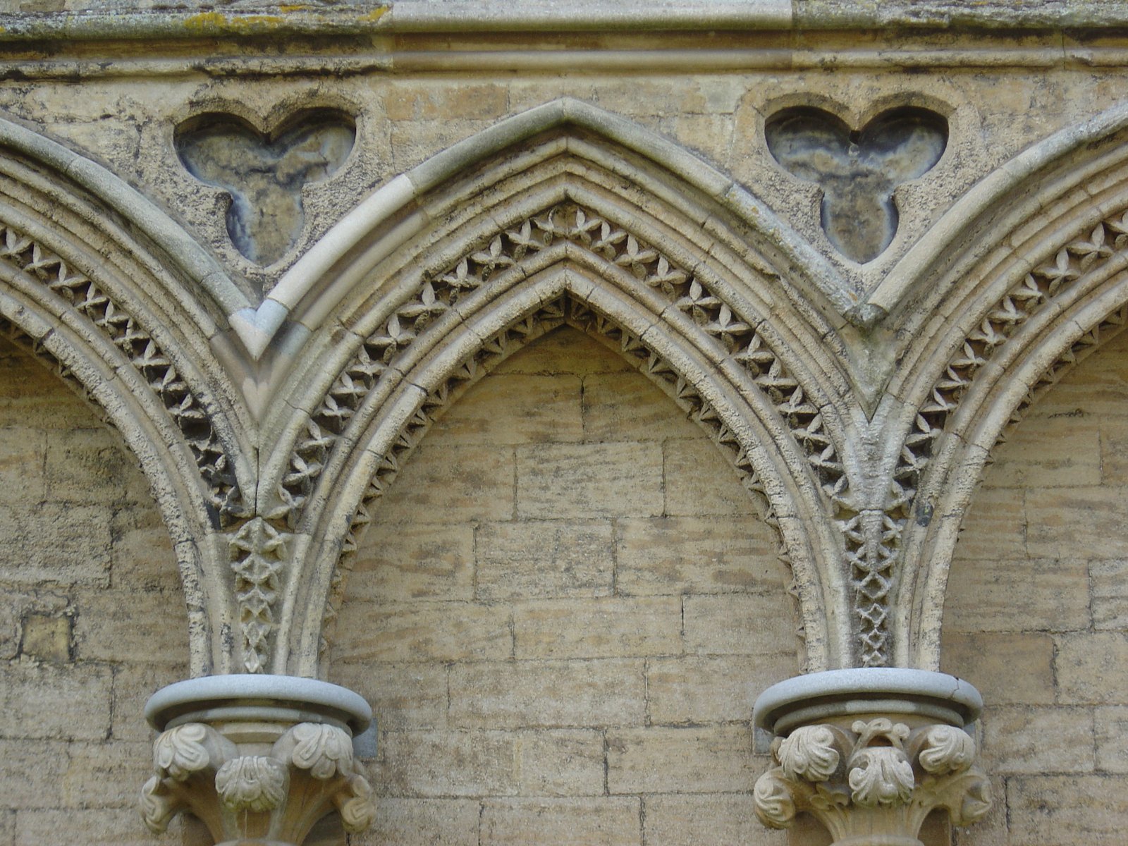 the arch of an old stone church is empty