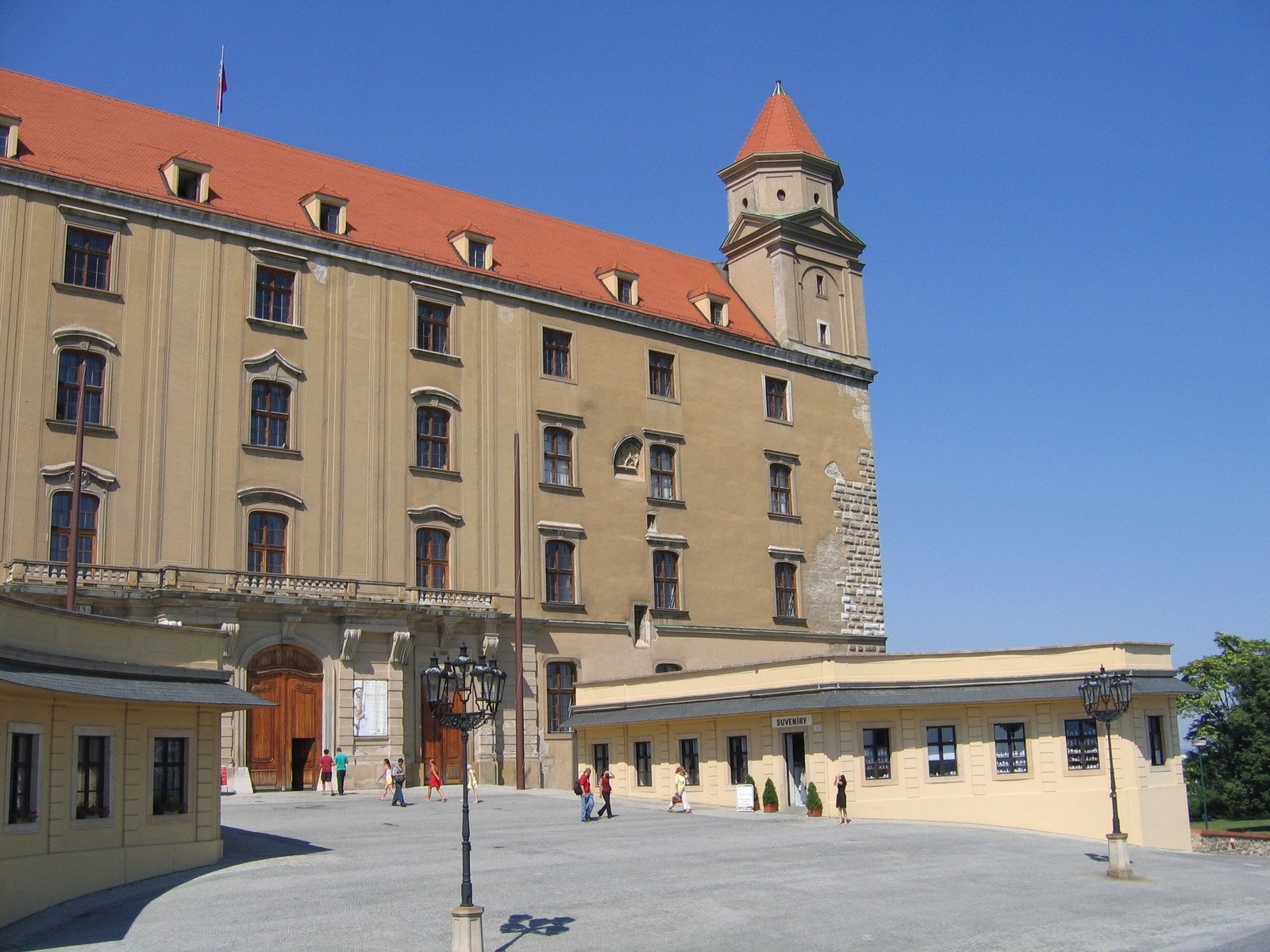 a large brown building with a clock tower on the roof